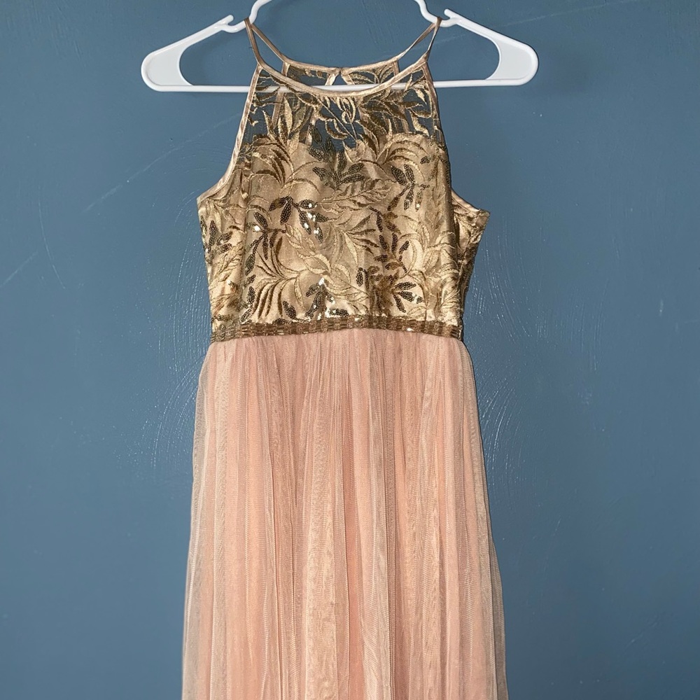 Very good condition like new, and is rose gold with gold